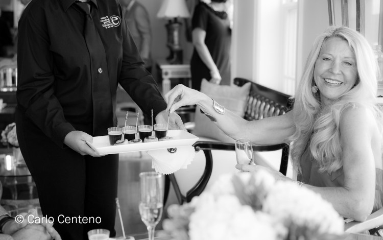Nancy Hoffman samples one of the many gourmet offerings.